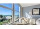 Large bedroom window offers breathtaking ocean views and a view of the pristine beach at 1701 Gulf Of Mexico Dr # 502, Longboat Key, FL 34228