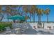 Outdoor patio area featuring a table with seating and partial view of beach with ocean at 1701 Gulf Of Mexico Dr # 502, Longboat Key, FL 34228