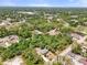 Home nestled within mature trees, offering both privacy and a peaceful neighborhood setting at 1709 Kerman St, North Port, FL 34288