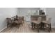 Dining area with a round table, chairs, and open to the kitchen at 1709 Kerman St, North Port, FL 34288