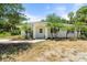 Charming home exterior with beautiful landscaping and curb appeal at 1709 Kerman St, North Port, FL 34288