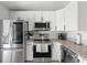 Updated kitchen featuring stainless steel appliances and white subway tile backsplash at 1709 Kerman St, North Port, FL 34288