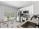 Modern kitchen with stainless steel appliances and granite countertops at 1709 Kerman St, North Port, FL 34288