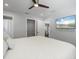 Main bedroom with a TV and walk in closet, perfect for relaxation and organization at 1709 Kerman St, North Port, FL 34288