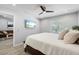 Main bedroom featuring a ceiling fan, natural light and an open doorway at 1709 Kerman St, North Port, FL 34288