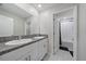 A bright bathroom with a dual sink vanity and a shower/tub combo at 1723 Fred Ives St, Ruskin, FL 33570