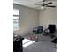 Bedroom featuring carpeted floors, a ceiling fan, and a window at 1723 Fred Ives St, Ruskin, FL 33570