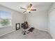 A simple bedroom with neutral tones, a ceiling fan, carpeted floors and plenty of space at 1723 Fred Ives St, Ruskin, FL 33570