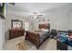 Primary bedroom with a ceiling fan, a comfortable bed, dresser, and carpeted floors, creating a relaxing retreat at 1723 Fred Ives St, Ruskin, FL 33570