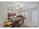 Cozy primary bedroom with a ceiling fan, a comfortable bed, and carpeted floors, creating a peaceful retreat at 1723 Fred Ives St, Ruskin, FL 33570