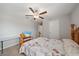 A cozy bedroom with a wooden ceiling fan, and a matching bedframe at 1723 Fred Ives St, Ruskin, FL 33570