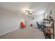 Spacious bonus room with neutral walls and carpet, ceiling fan and a flexible space for relaxation or entertainment at 1723 Fred Ives St, Ruskin, FL 33570