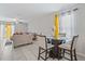 Comfortable dining area featuring a glass top table and seating for four, bathed in natural light at 1723 Fred Ives St, Ruskin, FL 33570