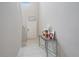 Bright entryway with neutral tones, tile floors, and decorative table at 1723 Fred Ives St, Ruskin, FL 33570