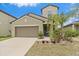 Charming single Gathering home with a well-maintained lawn and a beautiful blue sky at 1723 Fred Ives St, Ruskin, FL 33570