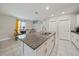 Spacious kitchen island features granite countertops, a stainless steel sink, and ample storage space at 1723 Fred Ives St, Ruskin, FL 33570