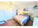Bedroom featuring hardwood floors, ceiling fan, and closet for storage at 1819 Restful Dr # N25, Bradenton, FL 34207