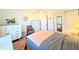 Bedroom featuring hardwood floors, ceiling fan, and closet for storage at 1819 Restful Dr # N25, Bradenton, FL 34207