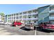 Three-story condominium building featuring parking and balconies for each unit at 1819 Restful Dr # N25, Bradenton, FL 34207