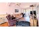 Comfortable living room featuring sliding glass doors to a screened lanai at 1819 Restful Dr # N25, Bradenton, FL 34207