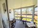 Enclosed sunroom offers a bright space to relax, with outside views, and comfortable seating at 1819 Restful Dr # N25, Bradenton, FL 34207