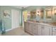 Updated bathroom with granite countertops, double vanity, and updated fixtures at 1836 Ironwood Ct, Venice, FL 34293