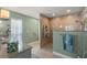 Updated bathroom with granite countertops and tiled walk-in shower at 1836 Ironwood Ct, Venice, FL 34293