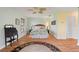 Bedroom with wood floors, desk and ceiling fan at 1836 Ironwood Ct, Venice, FL 34293