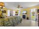 Bright bedroom features tiled floors, a fireplace, and sliding doors to a patio with views at 1836 Ironwood Ct, Venice, FL 34293