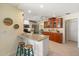 Eat-in kitchen showcases granite countertops, stainless appliances, and breakfast bar at 1836 Ironwood Ct, Venice, FL 34293