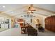 Open concept living area with vaulted ceiling, bar seating, and outdoor view at 1836 Ironwood Ct, Venice, FL 34293