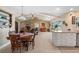 Open floor plan living area with vaulted ceilings and seamless indoor/outdoor living at 1836 Ironwood Ct, Venice, FL 34293