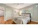 Comfortable bedroom features wood floors, neutral decor, ample closet space, and natural light at 1931 Bahia Vista St, Sarasota, FL 34239