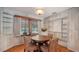 Charming breakfast nook with wood floors, built-in shelves, and a view of the backyard at 1931 Bahia Vista St, Sarasota, FL 34239