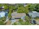 Aerial view of the charming home featuring a well-maintained yard and mature trees at 1931 Bahia Vista St, Sarasota, FL 34239