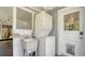 Laundry area featuring a stackable washer and dryer, a sink, and natural light at 1931 Bahia Vista St, Sarasota, FL 34239