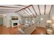 Bright living room with a fireplace, vaulted ceilings, hardwood floors, and comfortable seating at 1931 Bahia Vista St, Sarasota, FL 34239