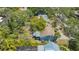 Aerial view showcasing the backyard, patio, landscaping, and the home's back exterior at 1931 Bahia Vista St, Sarasota, FL 34239