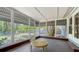 Screened porch with a round table and a view of the backyard at 1931 Bahia Vista St, Sarasota, FL 34239