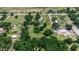 Aerial view of residential area with large tree-filled lots in sunny weather at 2040 Edmondson Rd, Nokomis, FL 34275