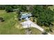 Close aerial view of single story home with long driveway at 2040 Edmondson Rd, Nokomis, FL 34275
