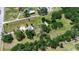 Aerial view of rural neighborhood with mature trees surrounding the houses at 2040 Edmondson Rd, Nokomis, FL 34275