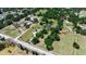 Bird's eye view of large lot with home, barn and lush greenery at 2040 Edmondson Rd, Nokomis, FL 34275
