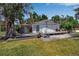 The house has a back porch with wood flooring at 2040 Edmondson Rd, Nokomis, FL 34275