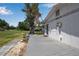 The house has a back porch and faces a big green yard at 2040 Edmondson Rd, Nokomis, FL 34275