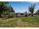 The house has a large backyard with green grass at 2040 Edmondson Rd, Nokomis, FL 34275