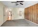 Spacious bedroom features a ceiling fan and doorway leading to an adjacent room at 2040 Edmondson Rd, Nokomis, FL 34275