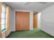 Bedroom features a window with curtains, a closet with sliding doors, and neutral walls at 2040 Edmondson Rd, Nokomis, FL 34275