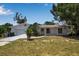 Well-kept home with large front lawn and attached garage on a bright sunny day at 2040 Edmondson Rd, Nokomis, FL 34275
