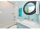 Stylish bathroom featuring subway tiles, a modern vanity, and tasteful decor at 205 Elm Ave, Anna Maria, FL 34216